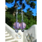 Falling earrings with silvered-pink cabochon